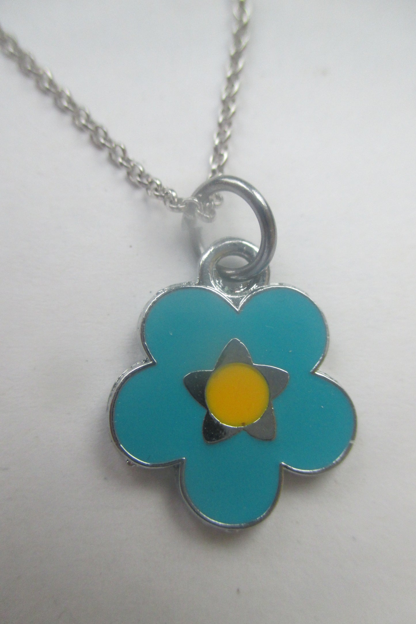 Enamel flower pendant