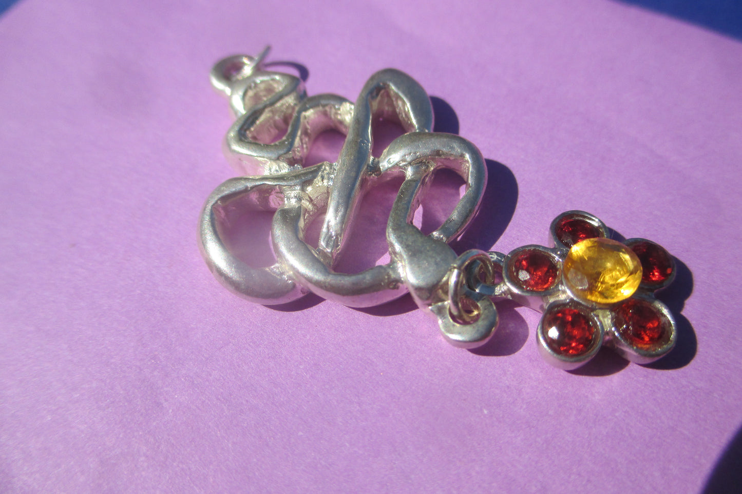 Silver snake pendant with flower drop