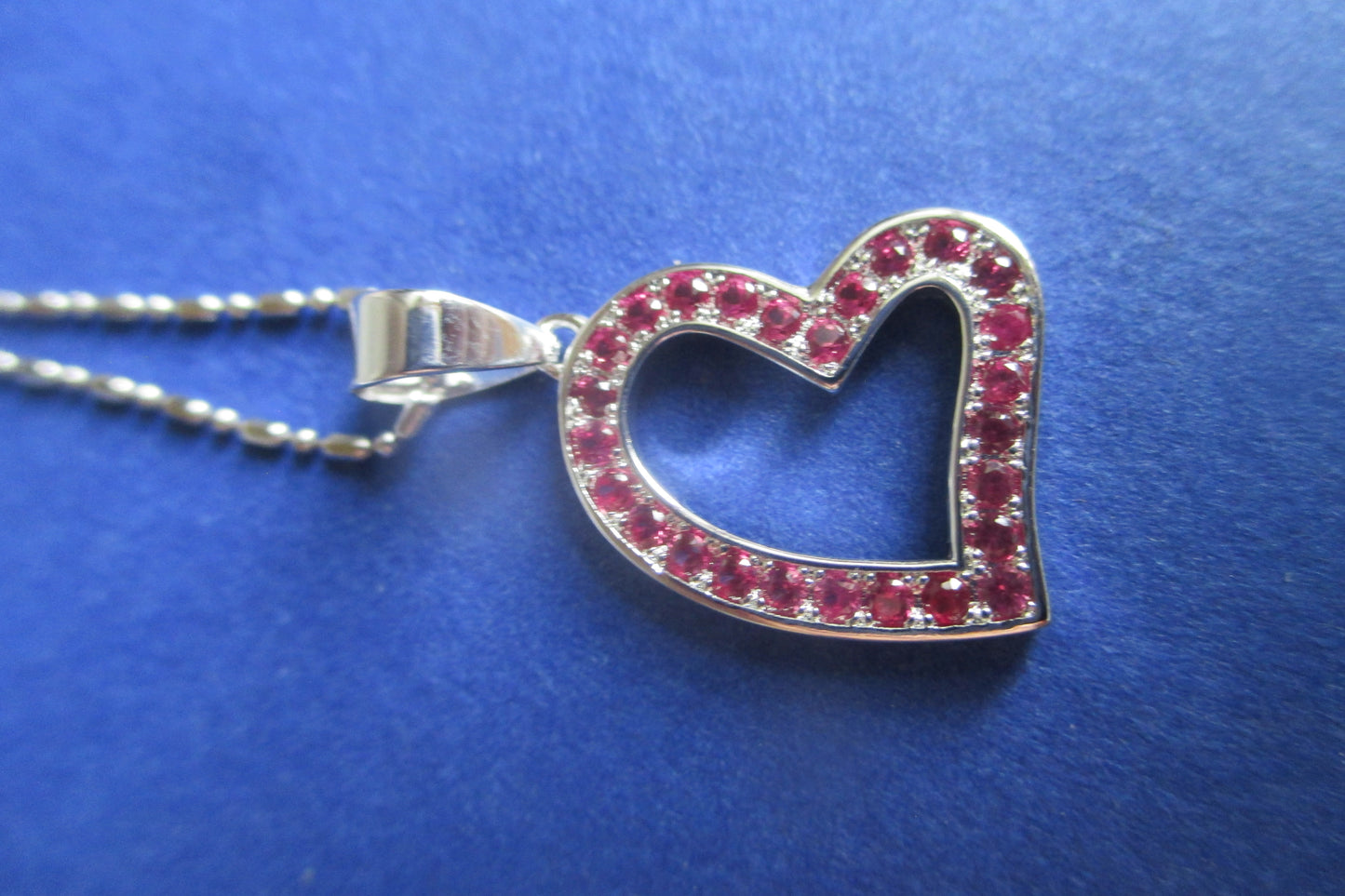 Silver heart with red accent pendant