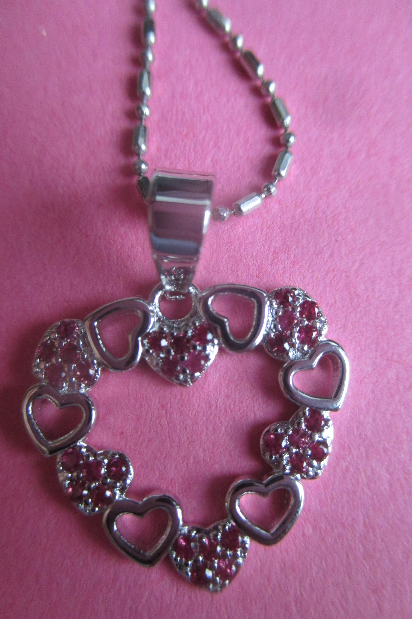 Silver hearts with red accent pendant