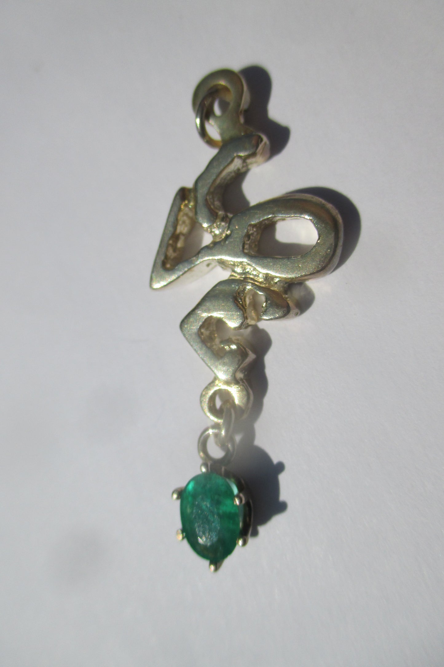 Silver Love with emerald drop pendant