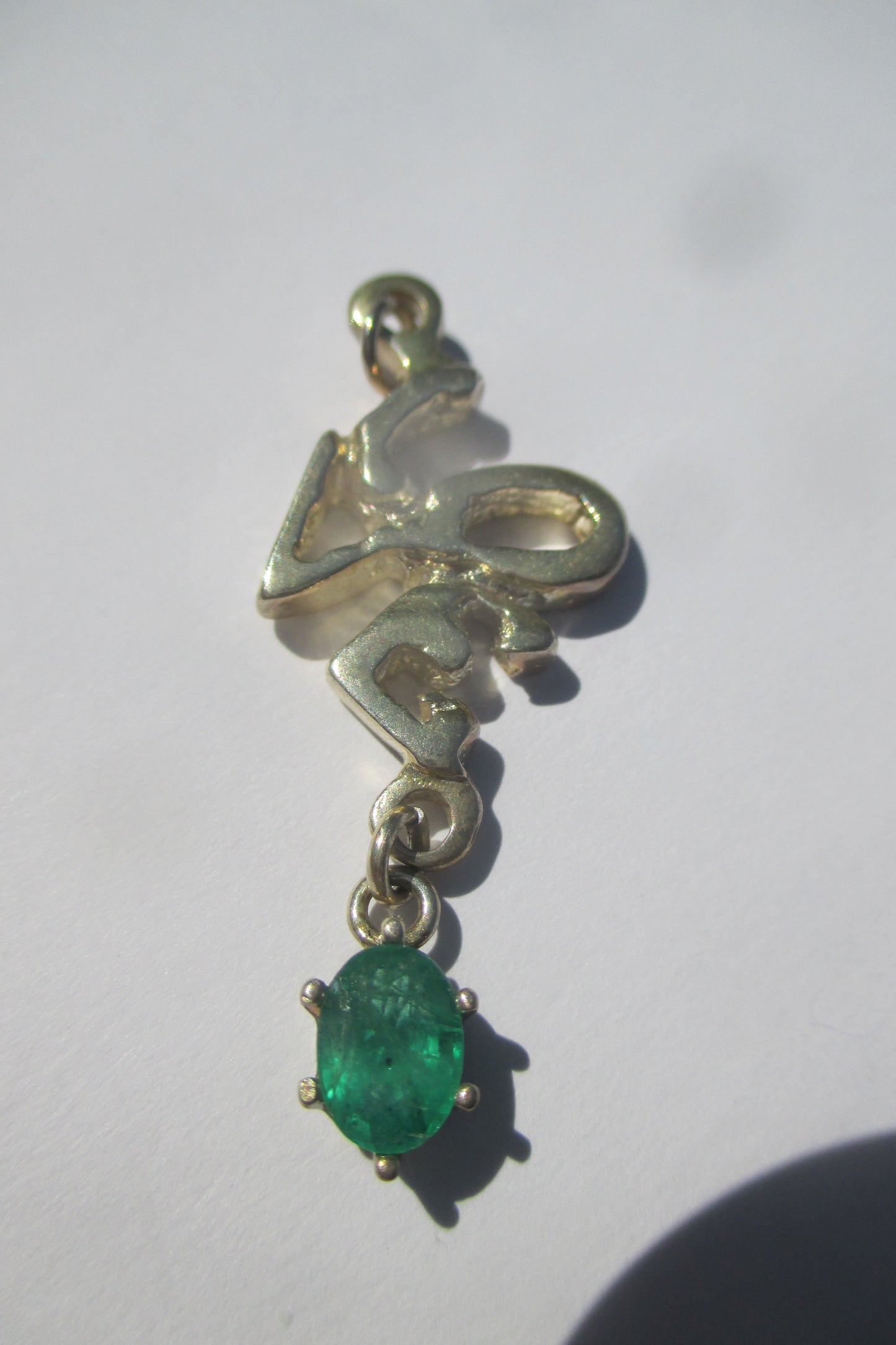 Silver Love with emerald drop pendant