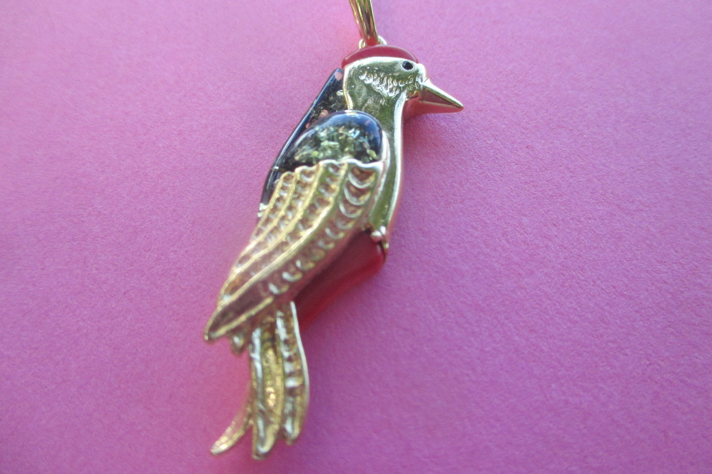 Amber woodpecker pendant