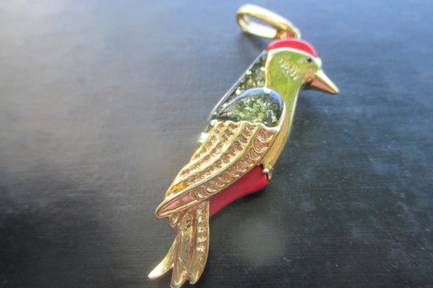Amber woodpecker pendant