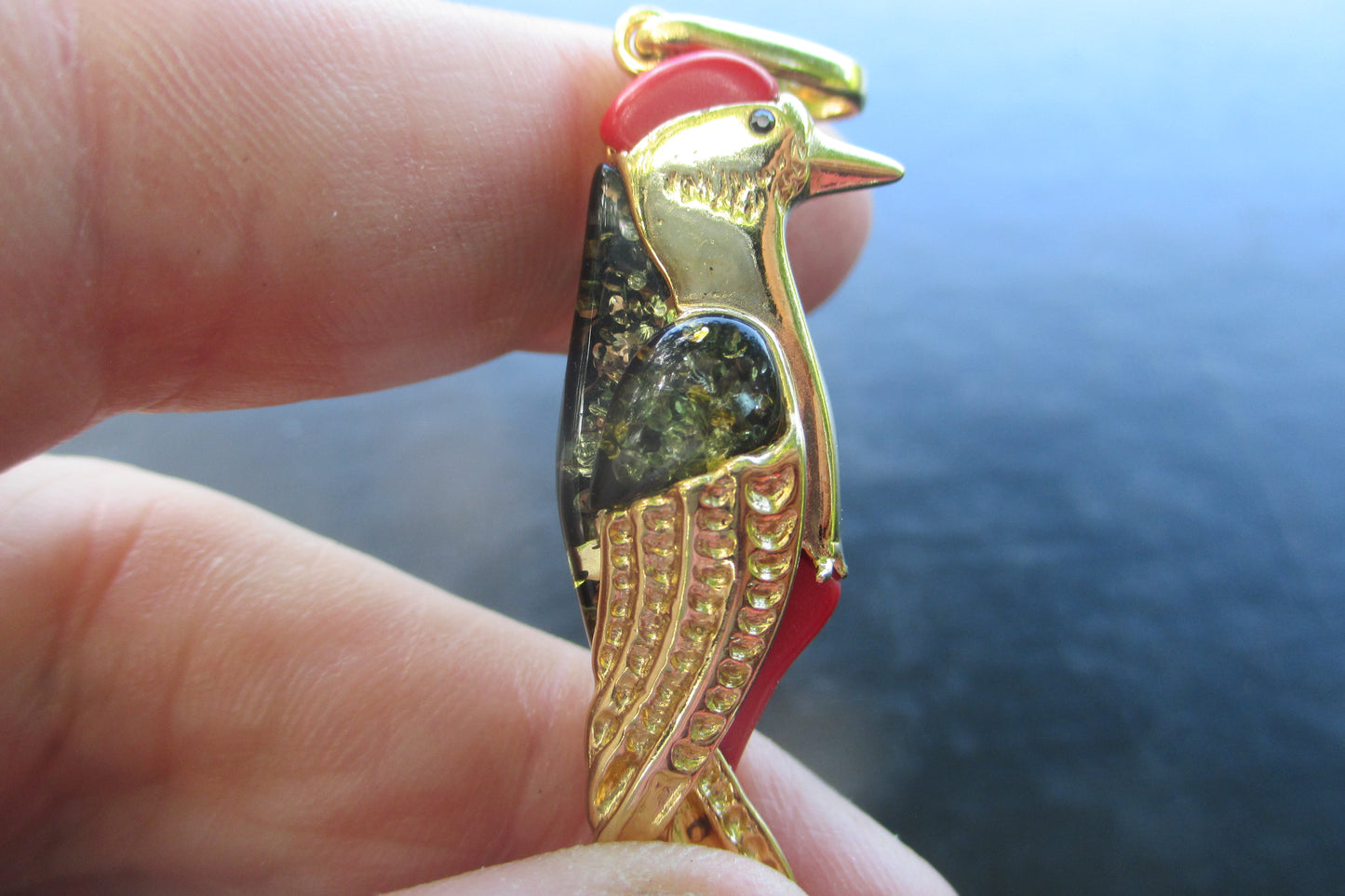Amber woodpecker pendant