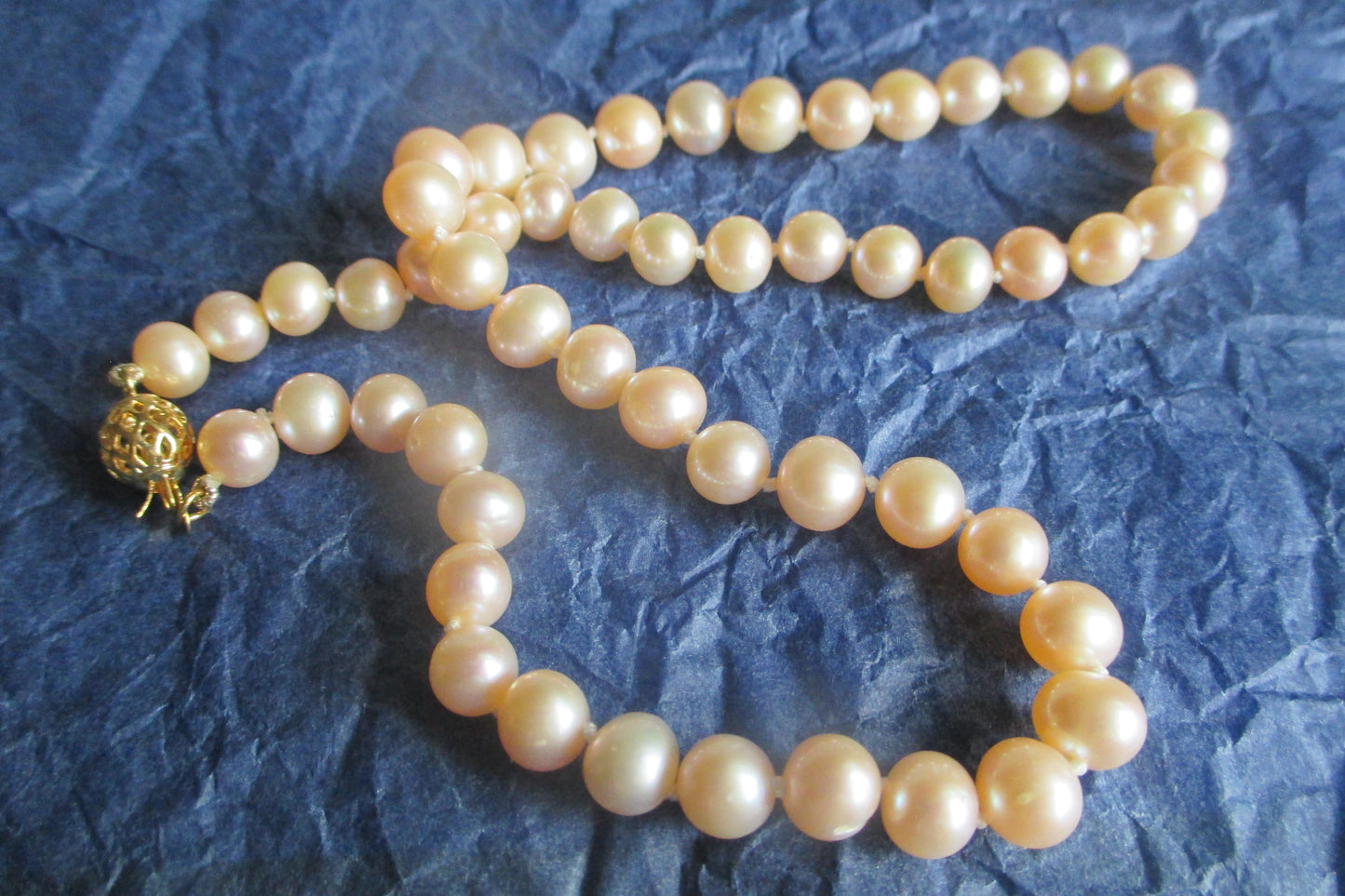 Pink pearl necklace with gold clasp