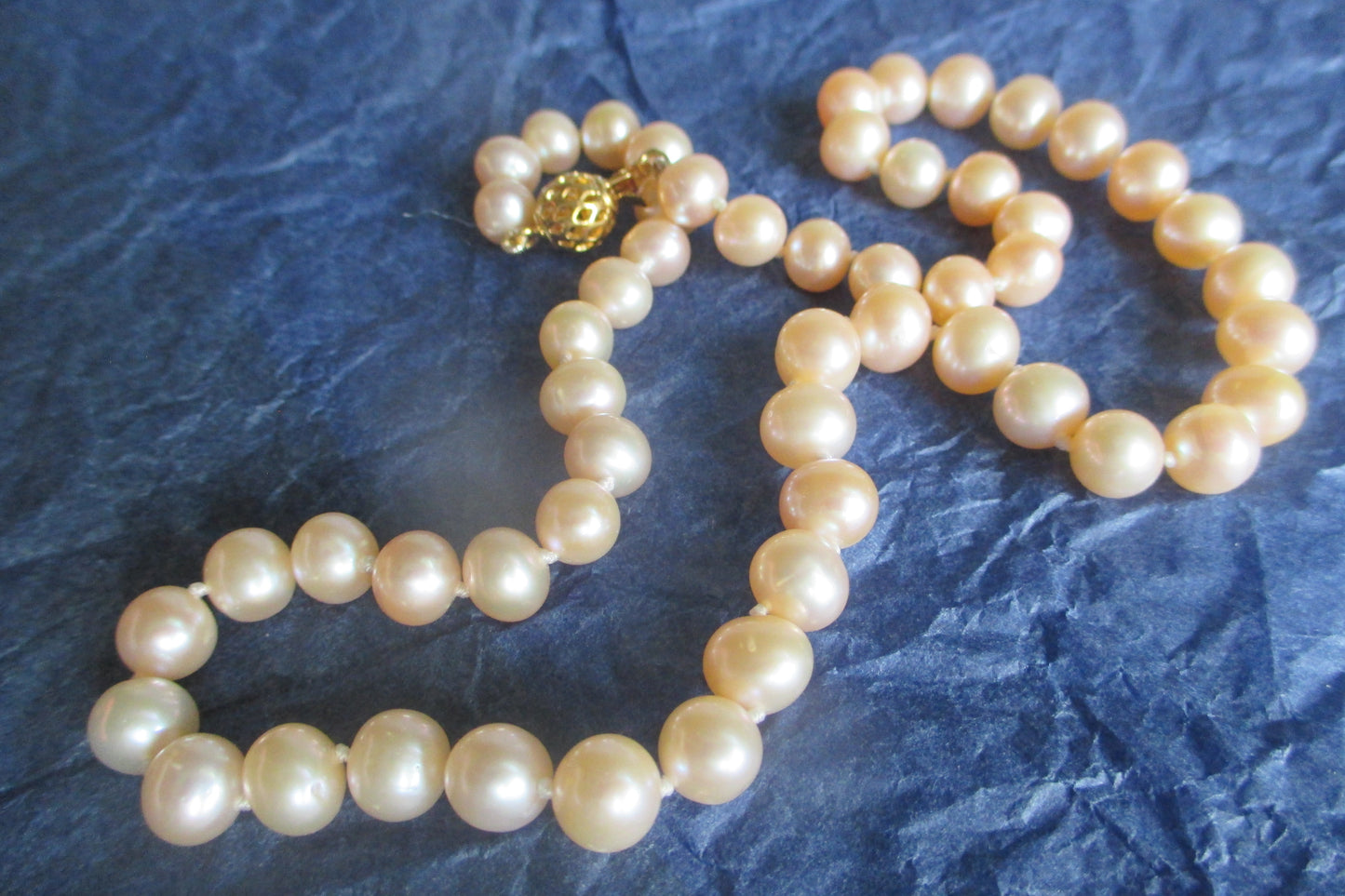 Pink pearl necklace with gold clasp