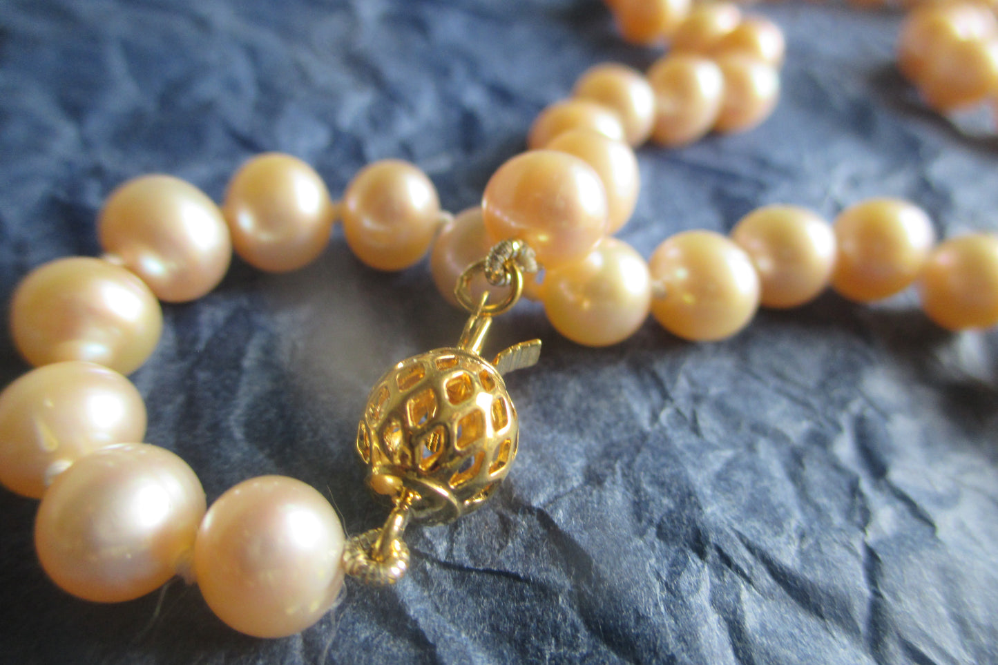 Pink pearl necklace with gold clasp