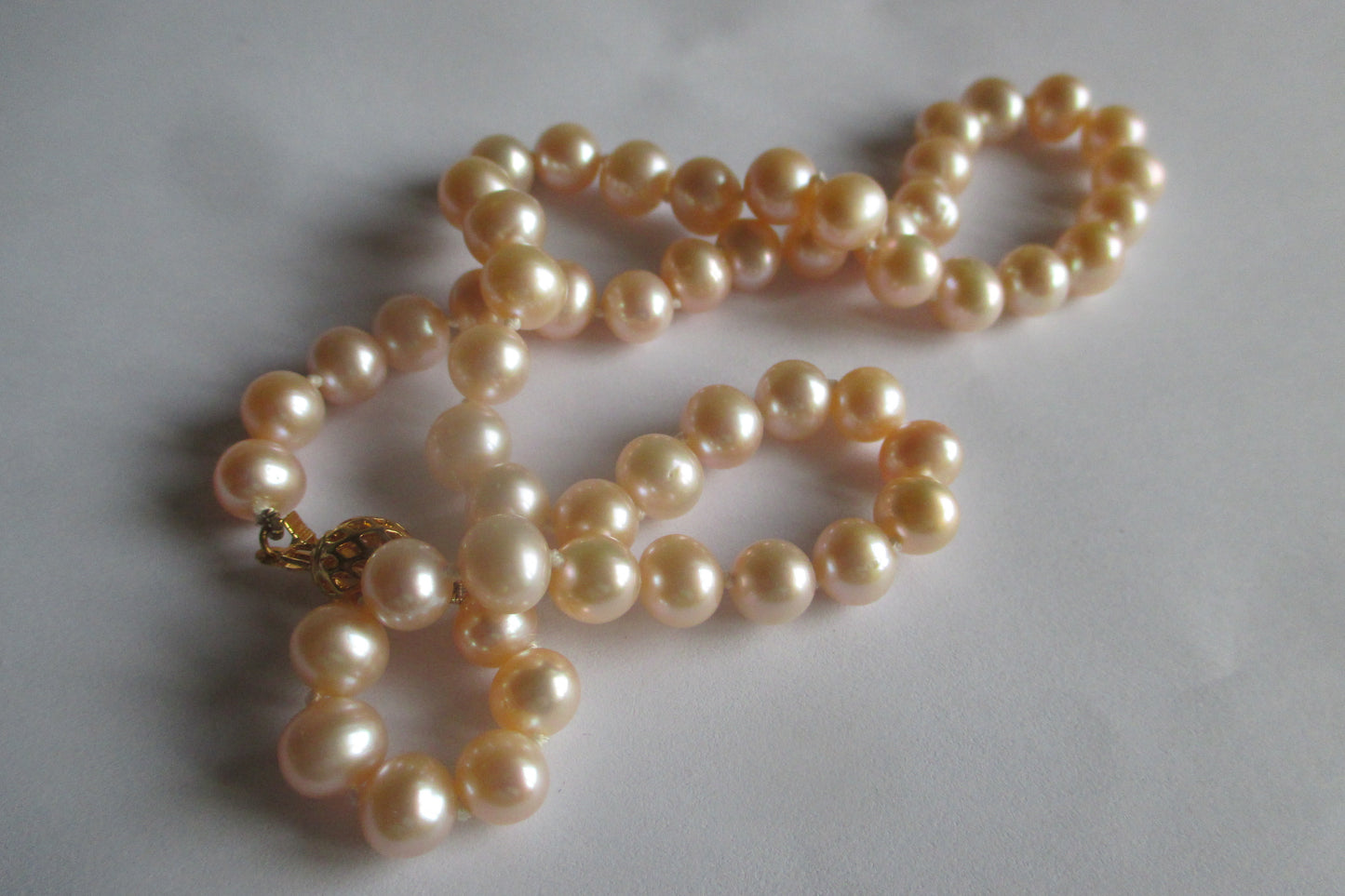 Pink pearl necklace with gold clasp