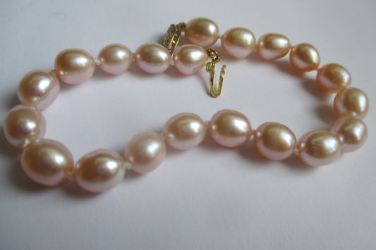 Pink pearl bracelet 14k gold clasp