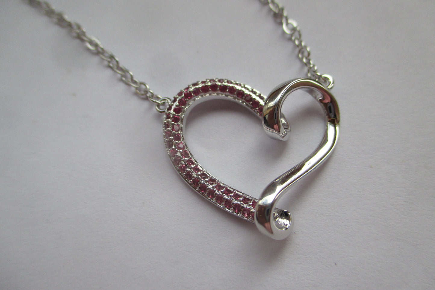 Silver heart with red accents pendant