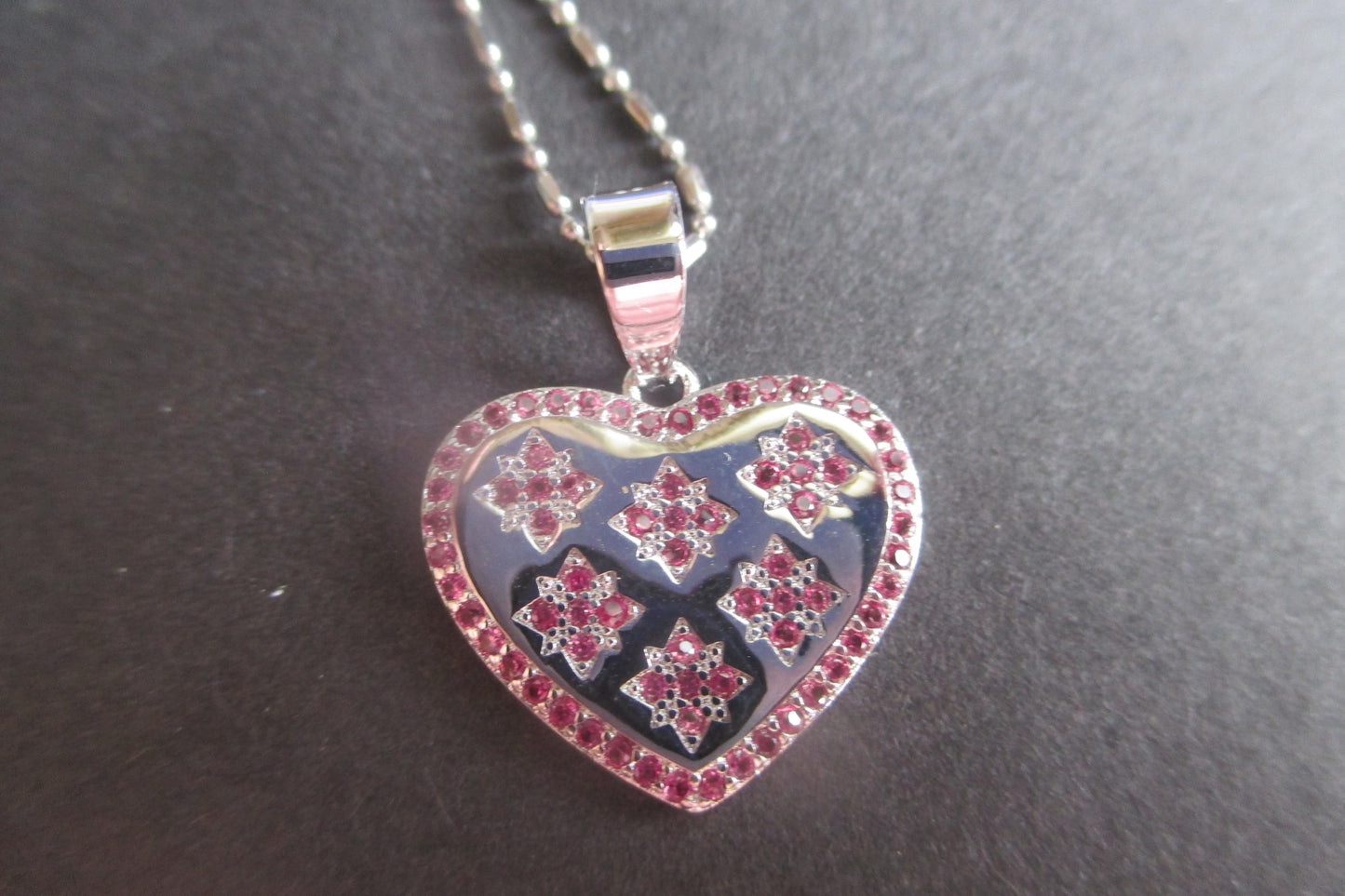 Silver heart with red accents pendant