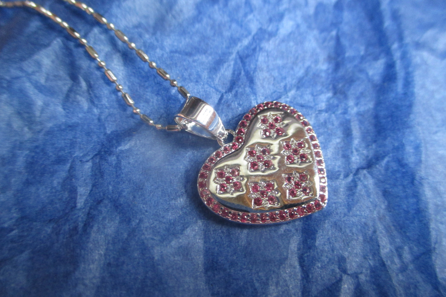 Silver heart with red accents pendant