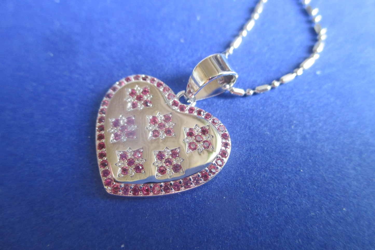 Silver heart with red accents pendant