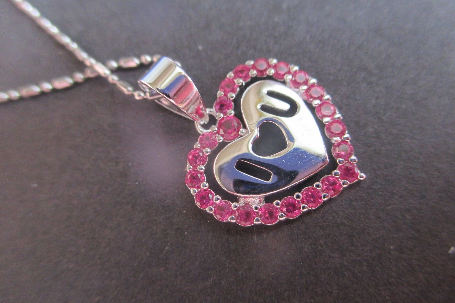 Silver heart with red accents pendant