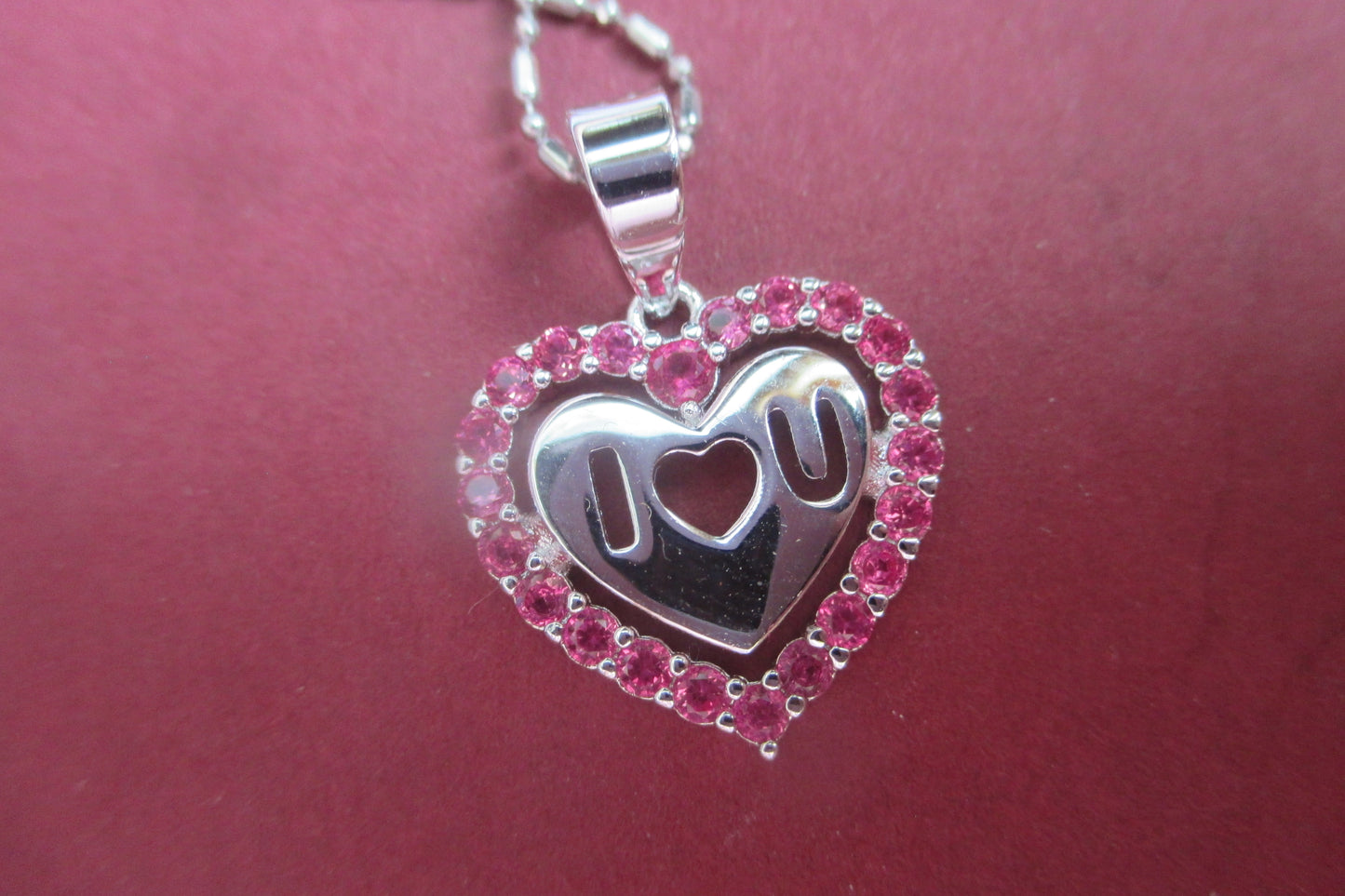 Silver heart with red accents pendant