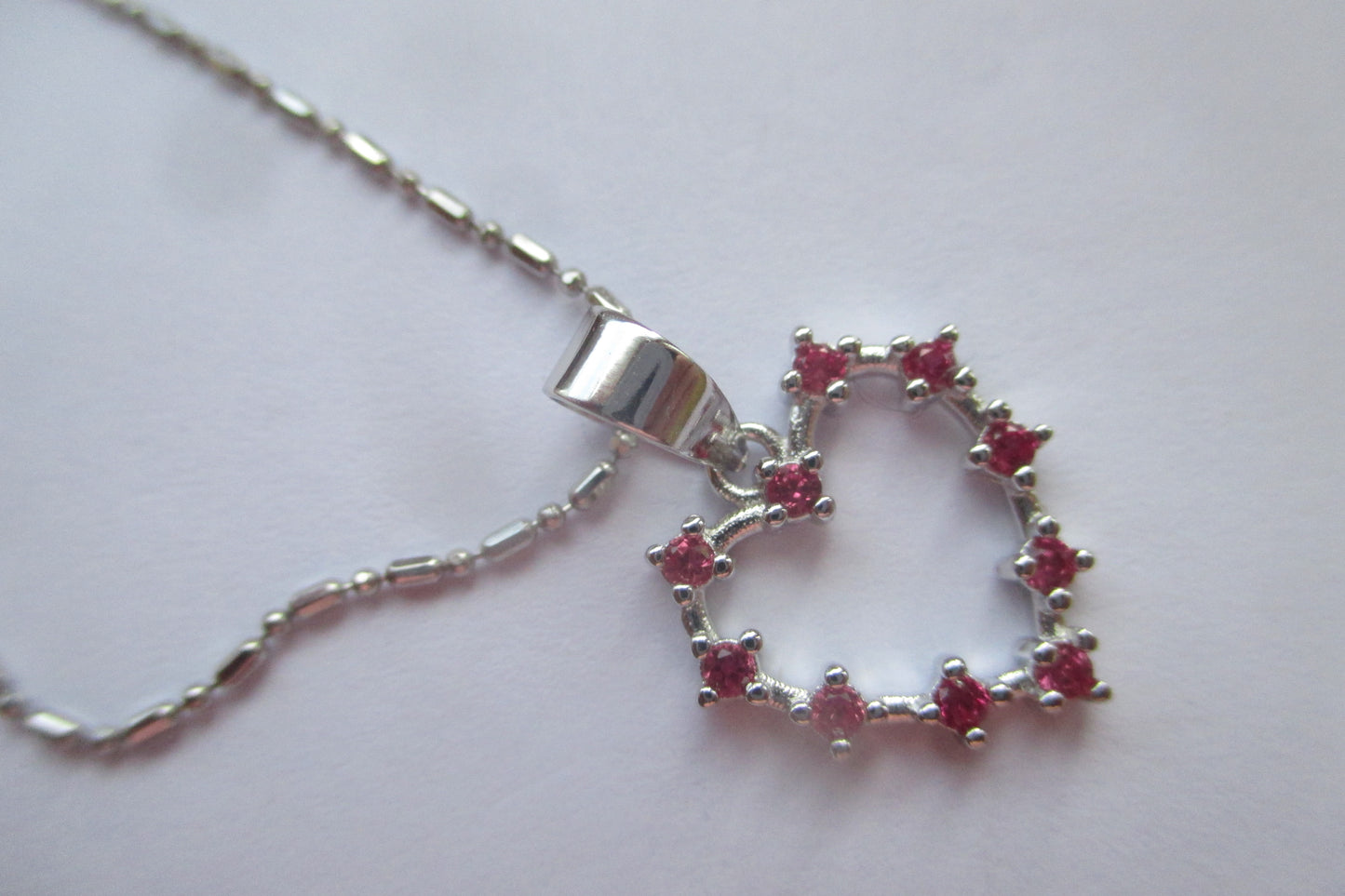 Silver heart with red accents pendant