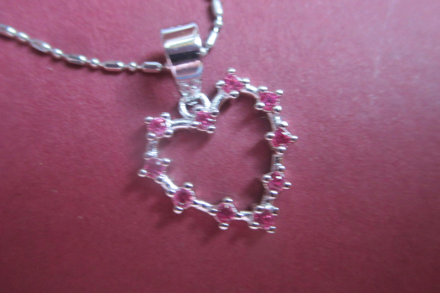 Silver heart with red accents pendant