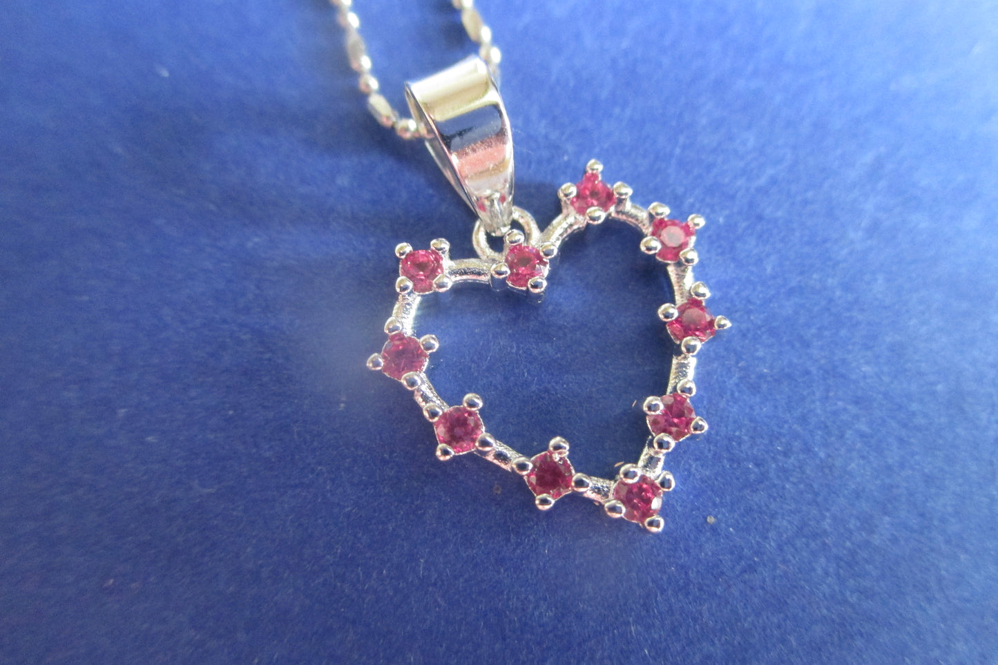 Silver heart with red accents pendant