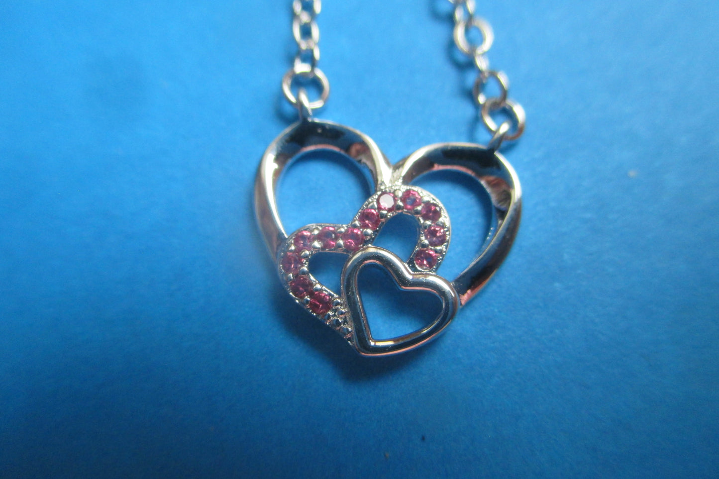 Silver hearts with red accents pendant