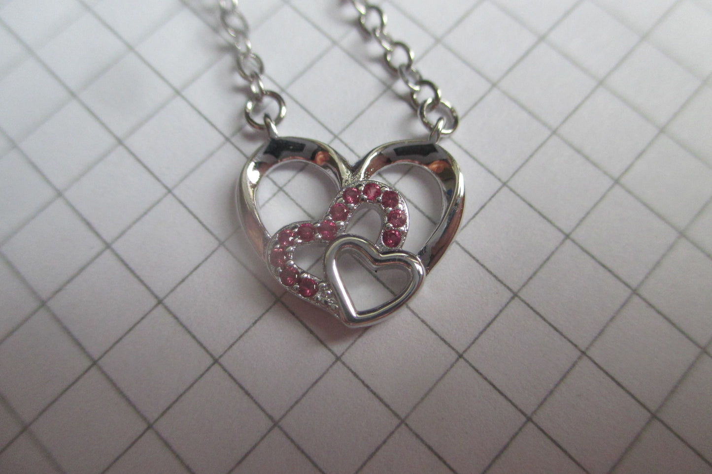 Silver hearts with red accents pendant