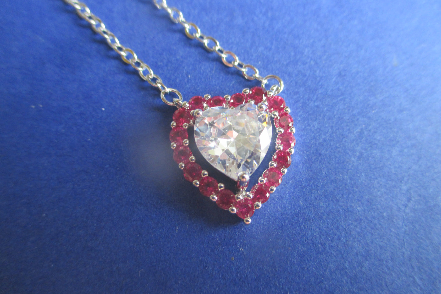 Silver heart with red accents pendant