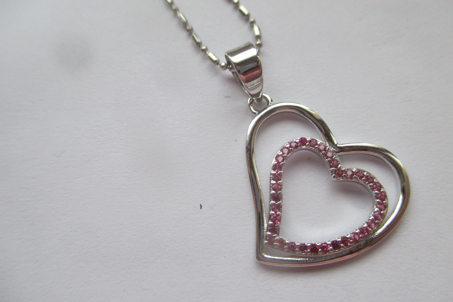 Silver heart with red accents pendant