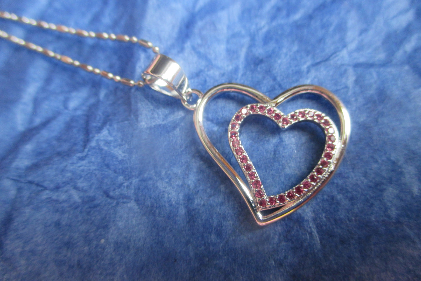 Silver heart with red accents pendant