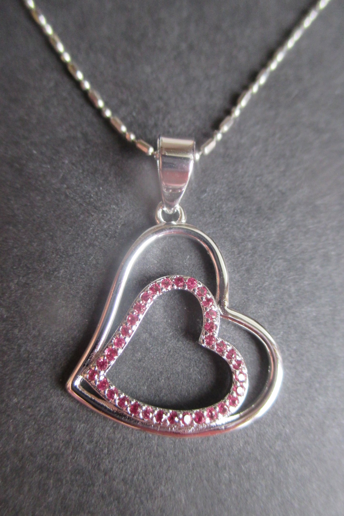 Silver heart with red accents pendant