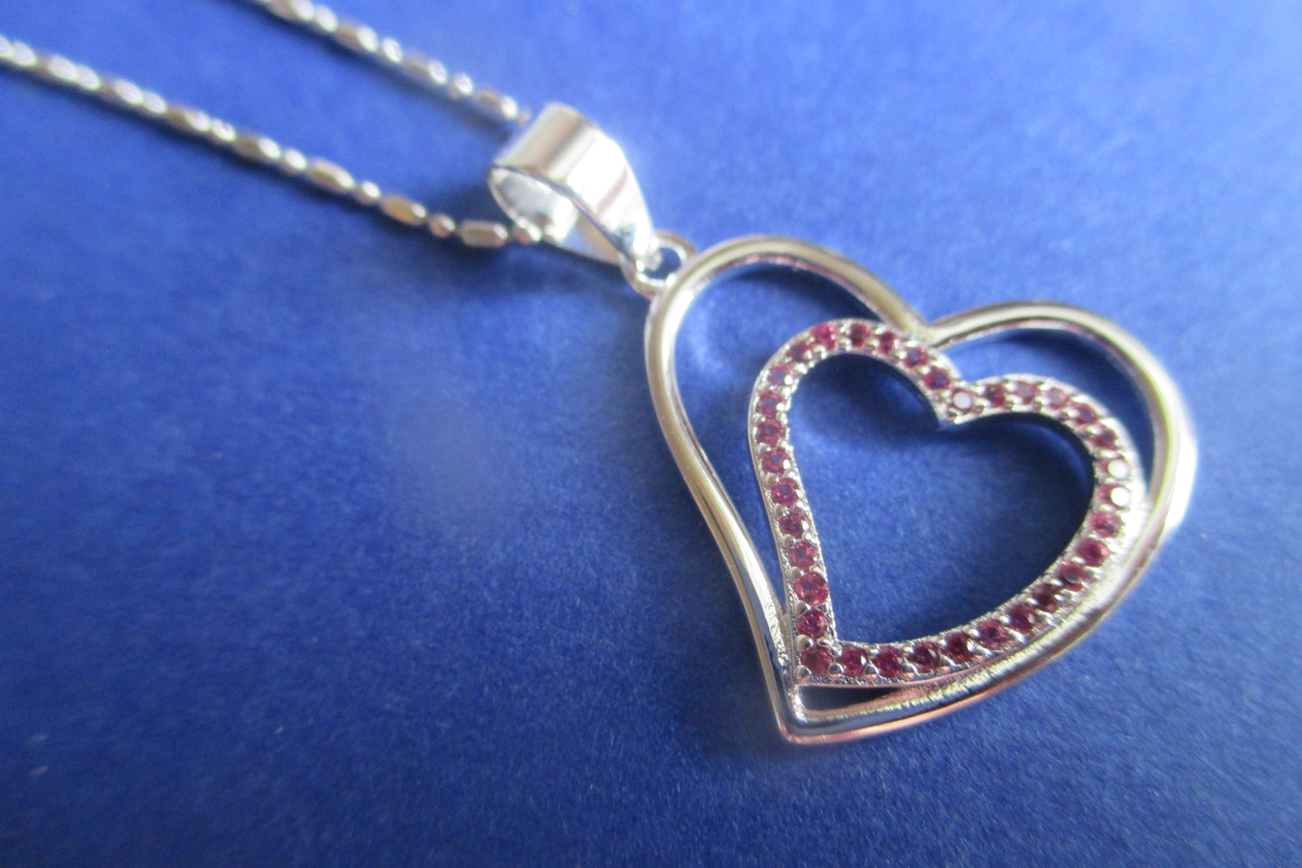 Silver heart with red accents pendant