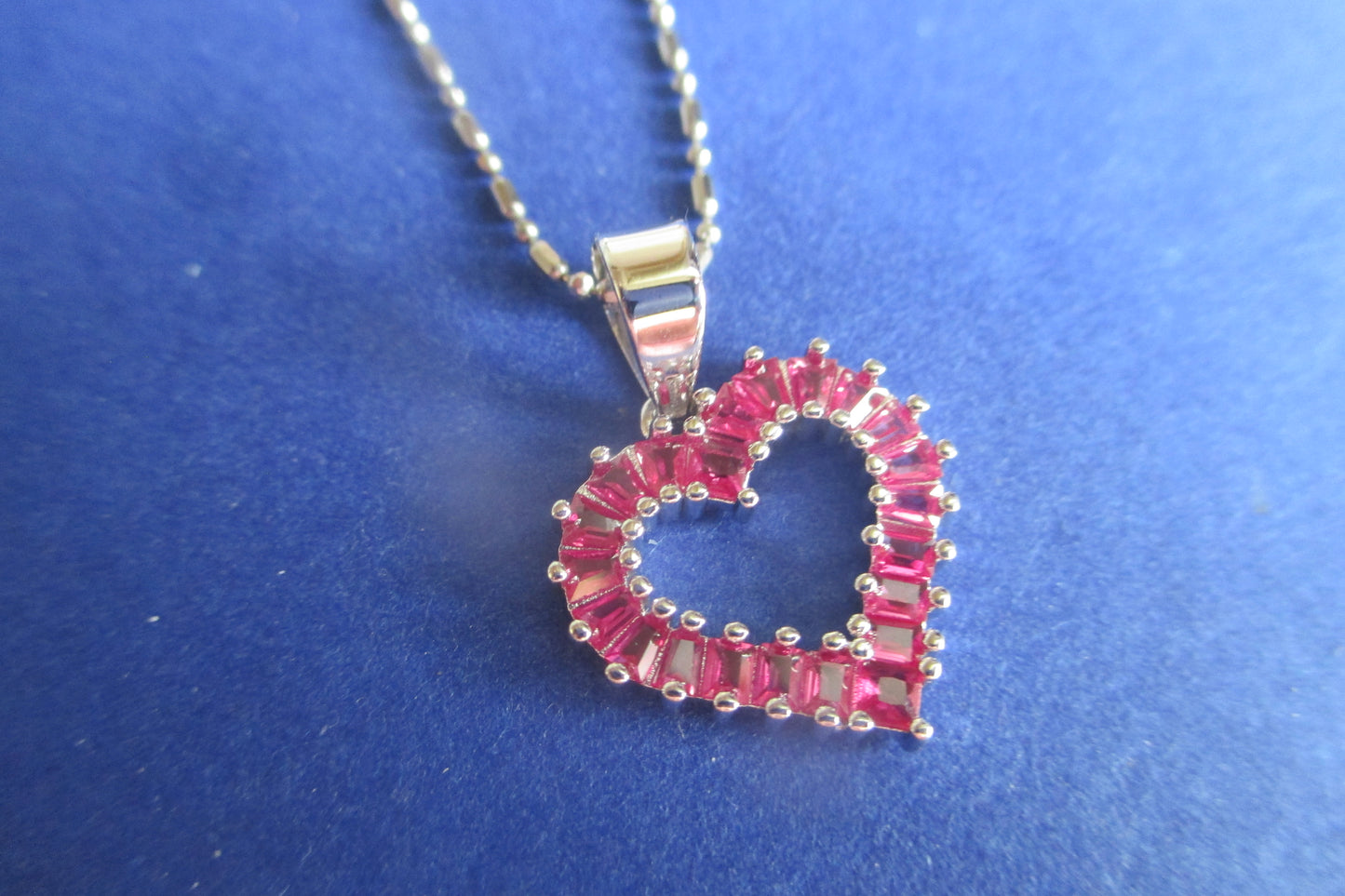 Silver heart with red accents pendant