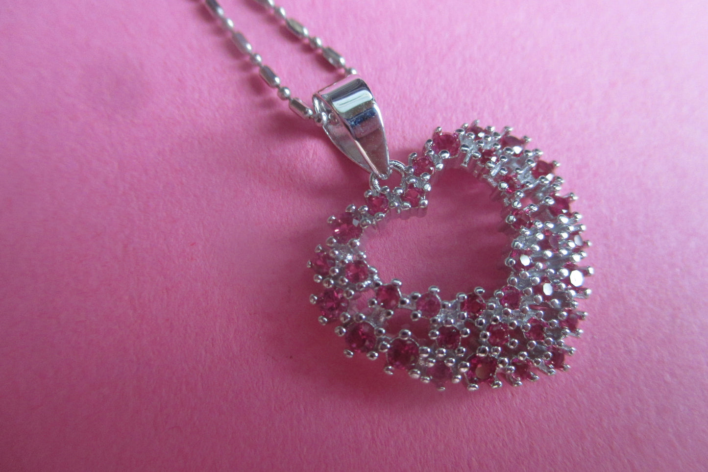 Silver heart with red accents pendant