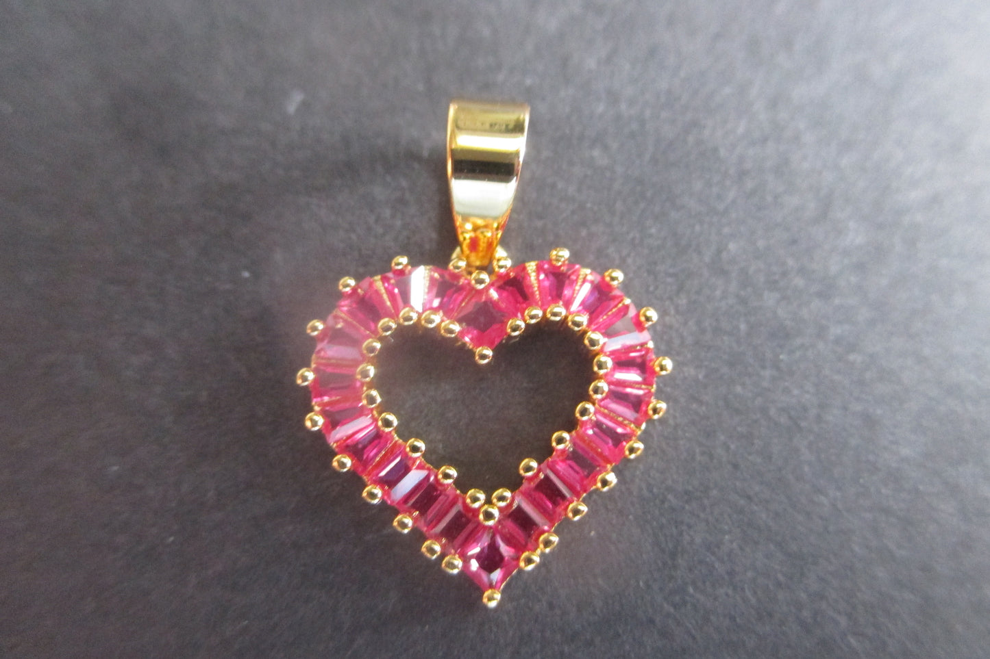 Gold plated HEART pendant with red stones.