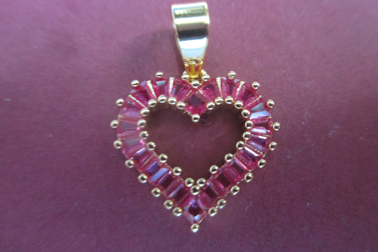 Gold plated HEART pendant with red stones.