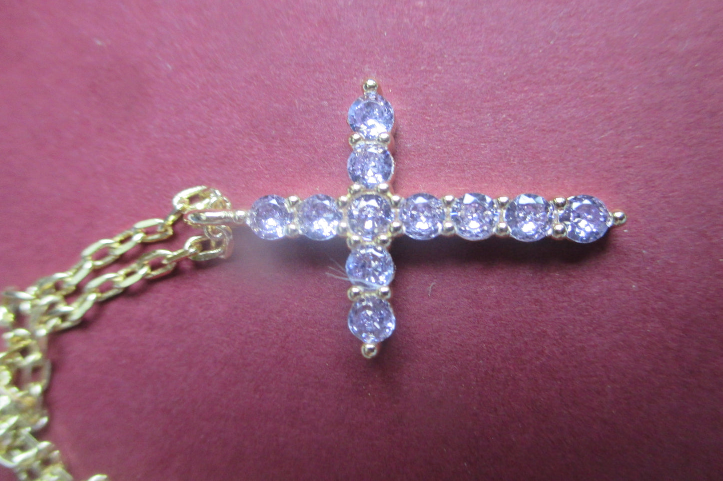 Gold plated violet stone cross pendant