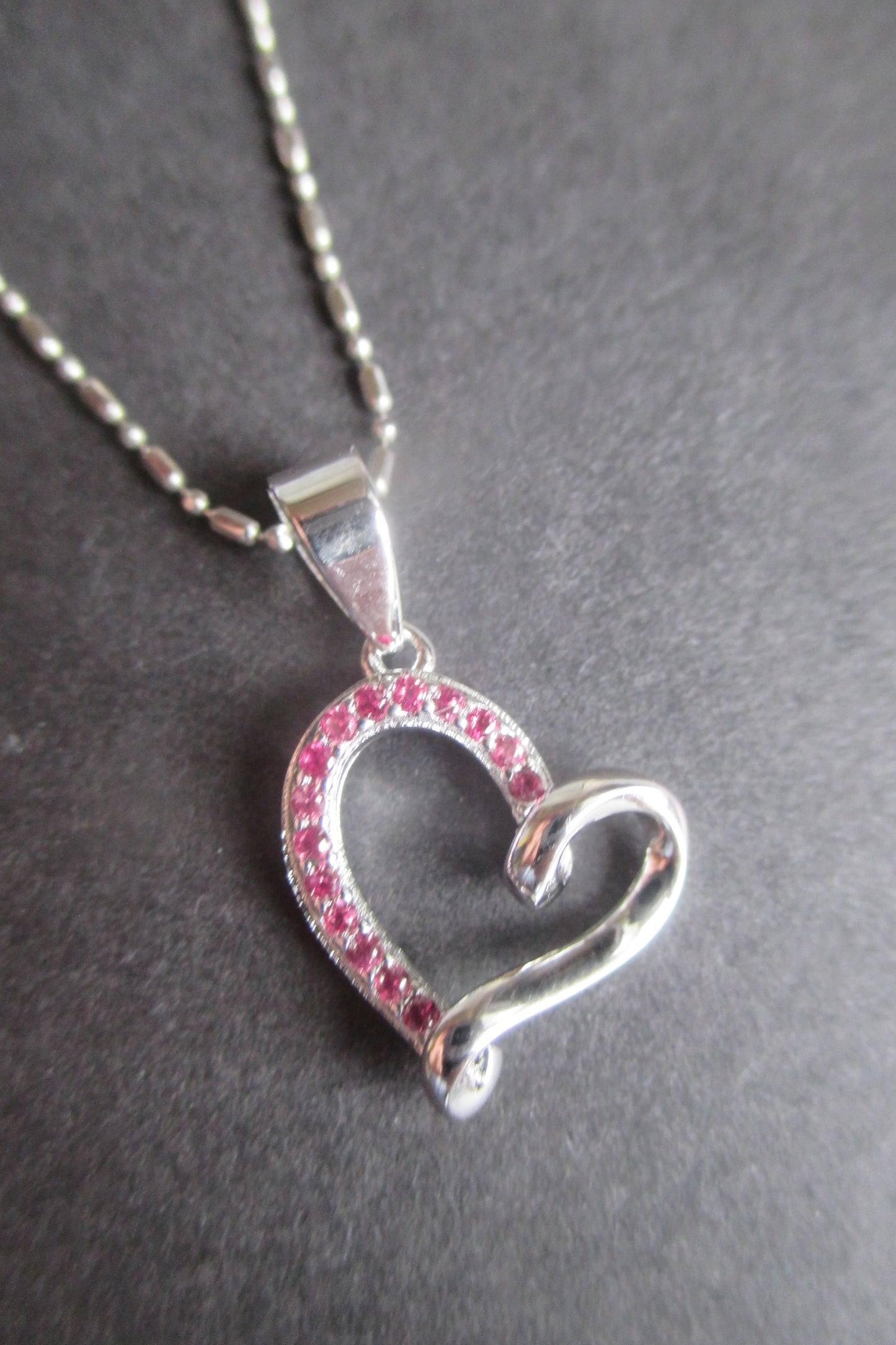 Silver heart with red accent pendant