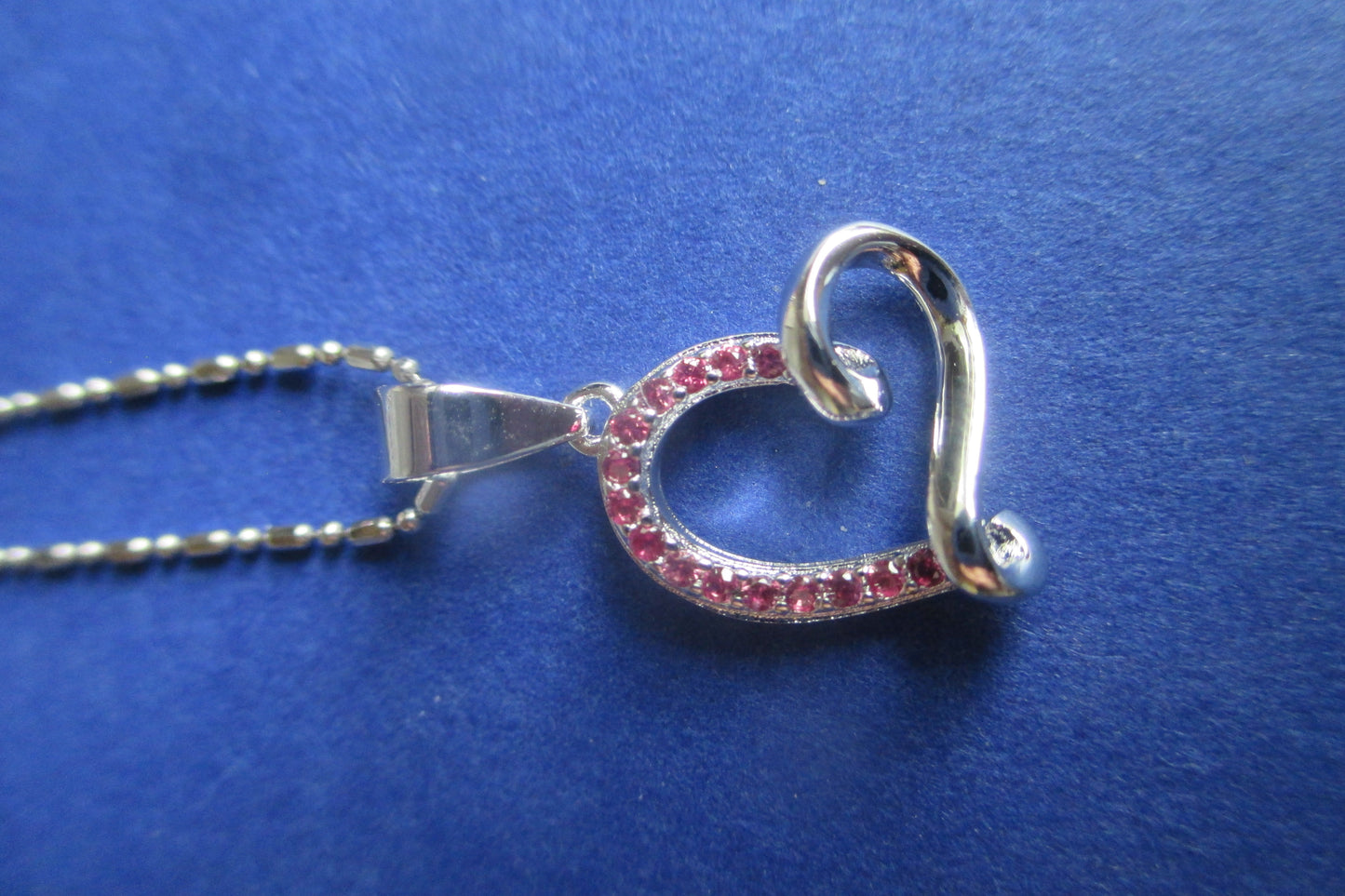 Silver heart with red accent pendant