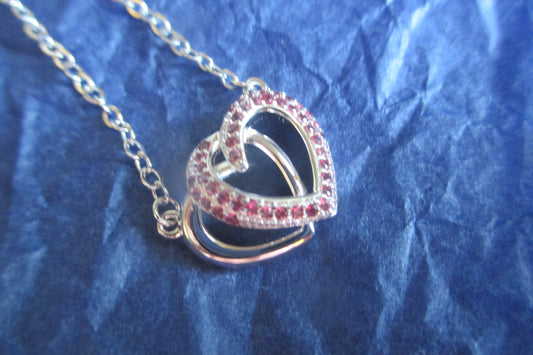 Silver hearts with red accents pendant