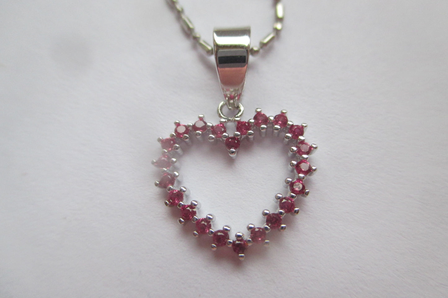 Silver heart with red accents pendant