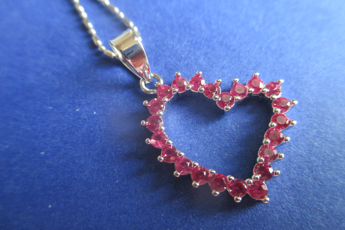 Silver heart with red accents pendant