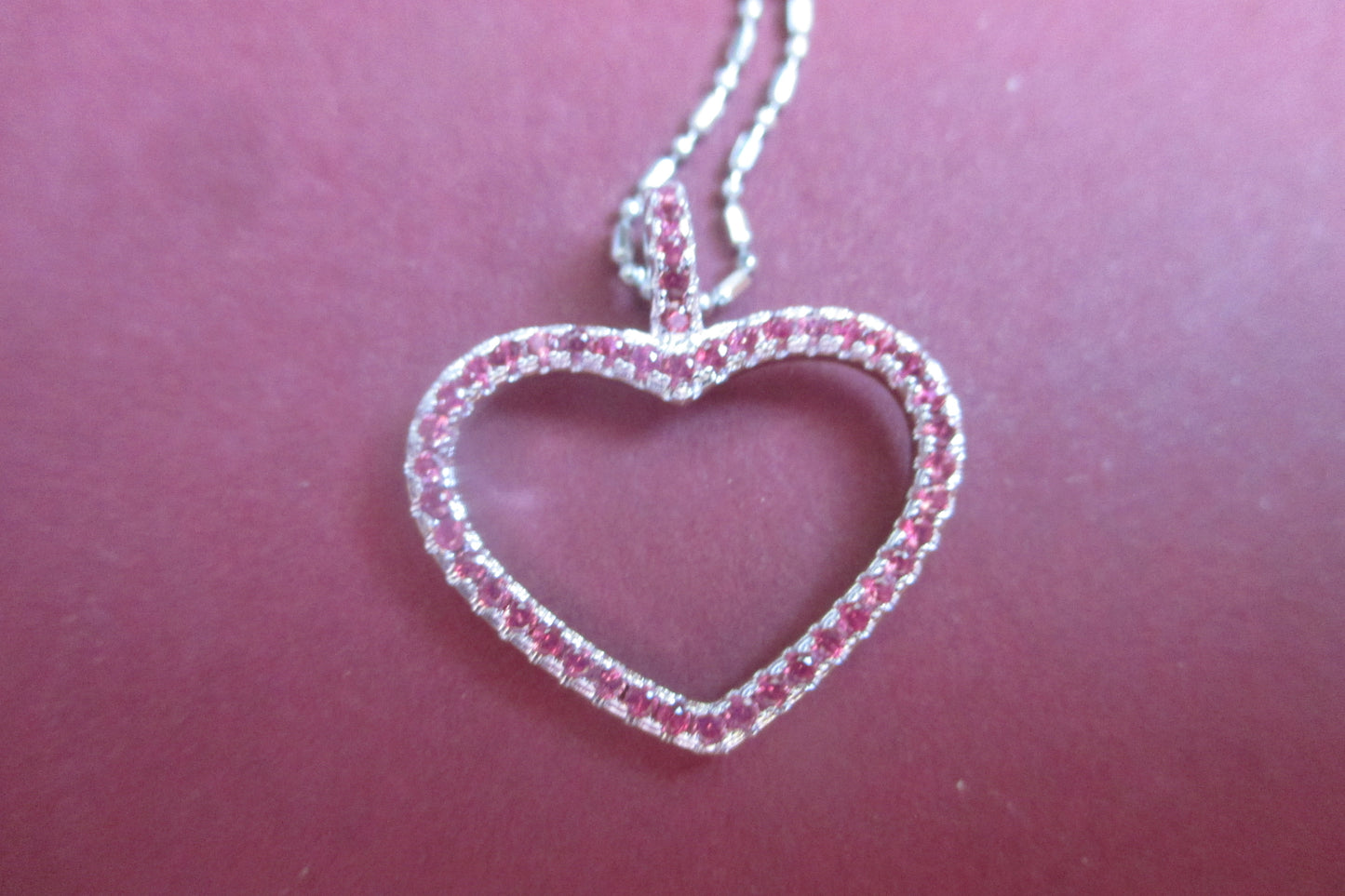 Silver heart with red accents pendant