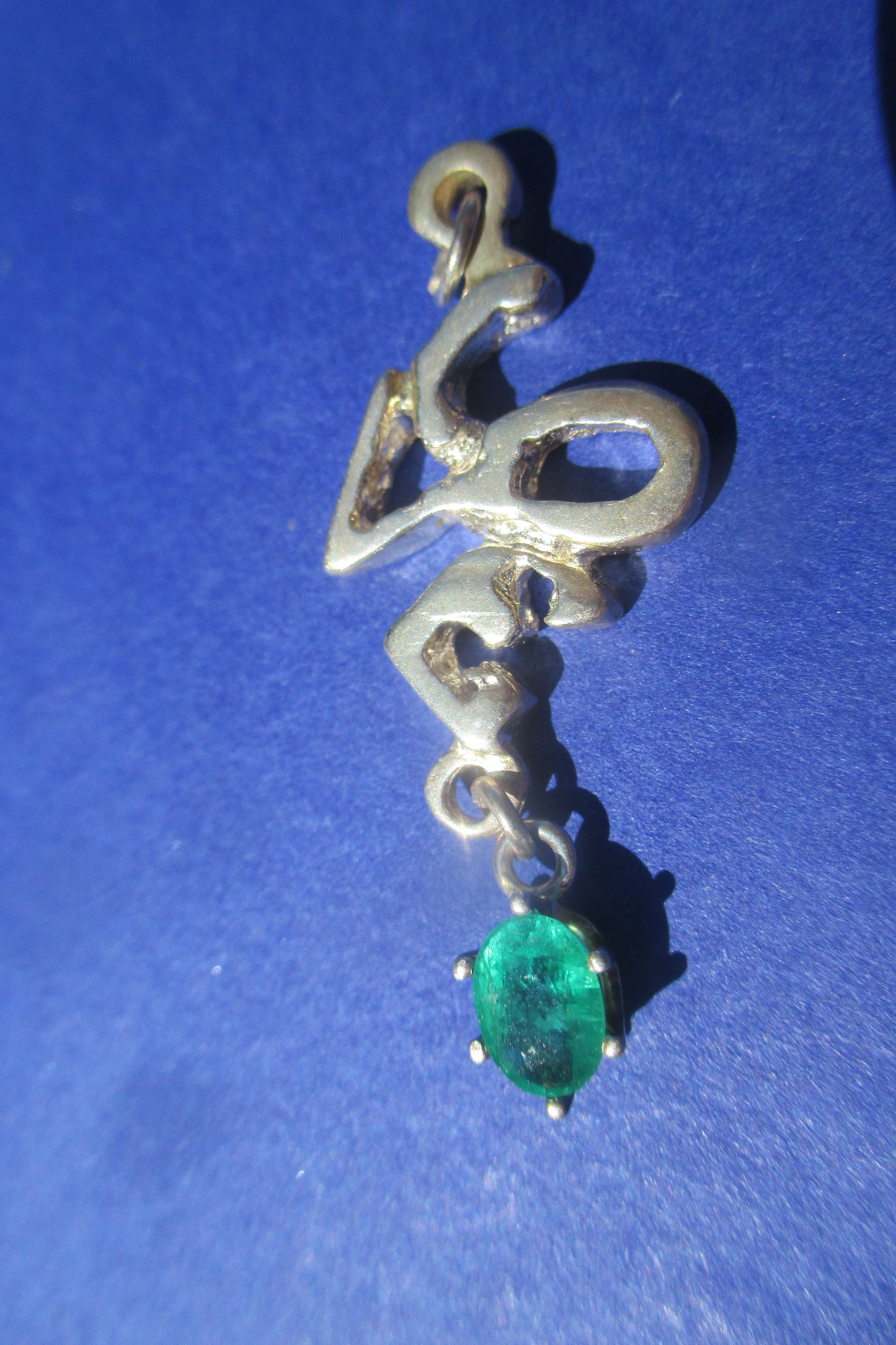 Silver Love with emerald drop pendant