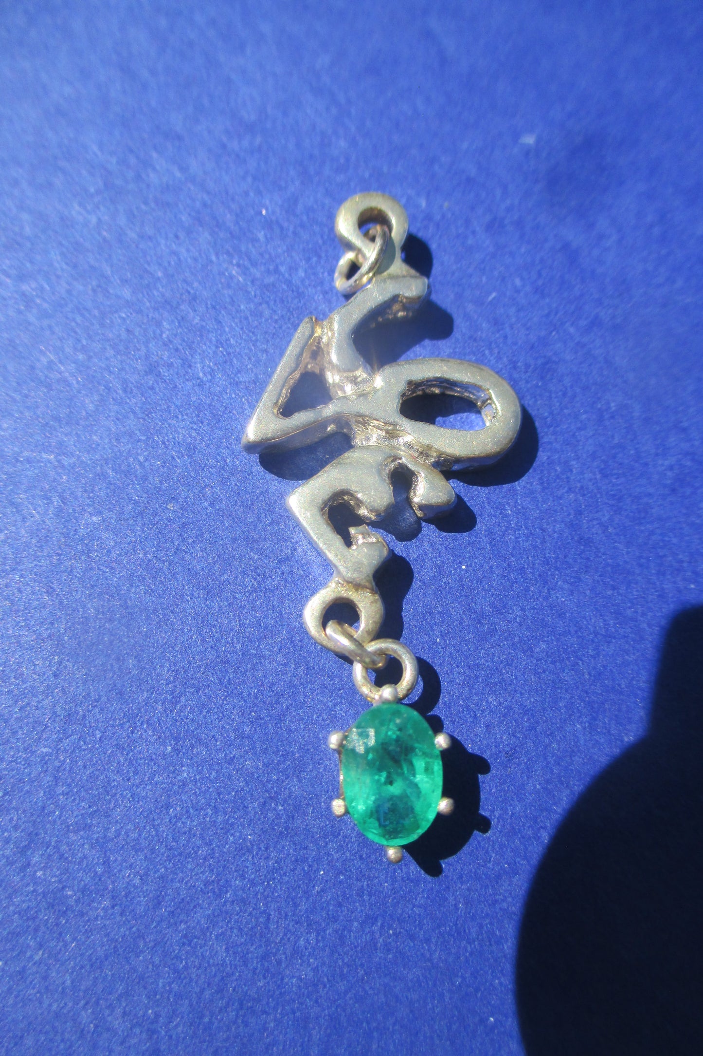 Silver Love with emerald drop pendant