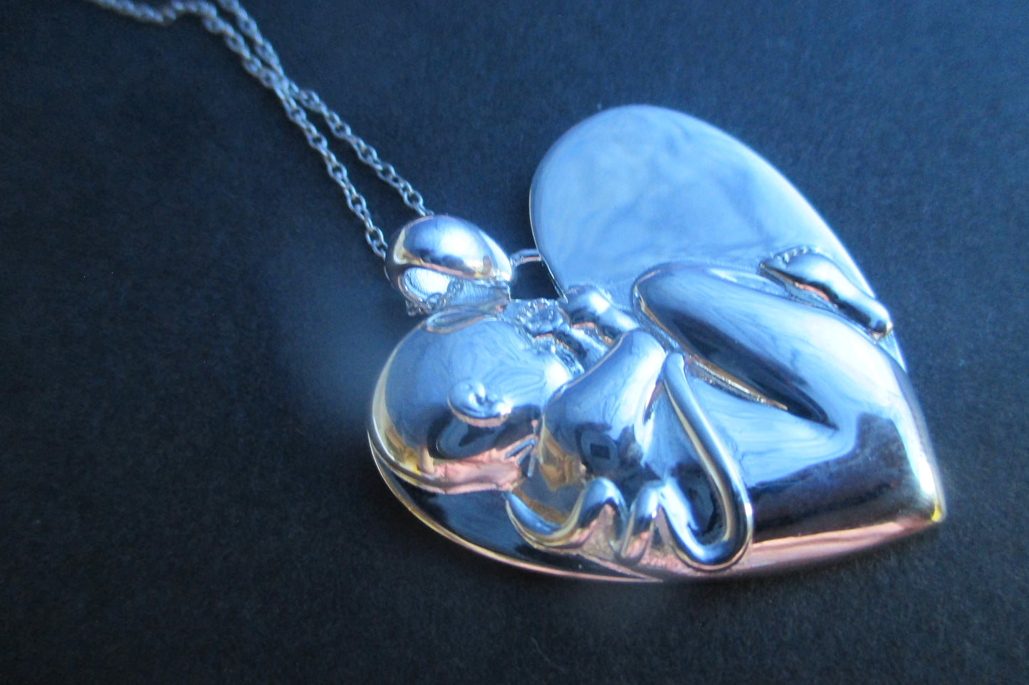 Silver heart Baby in womb pendant