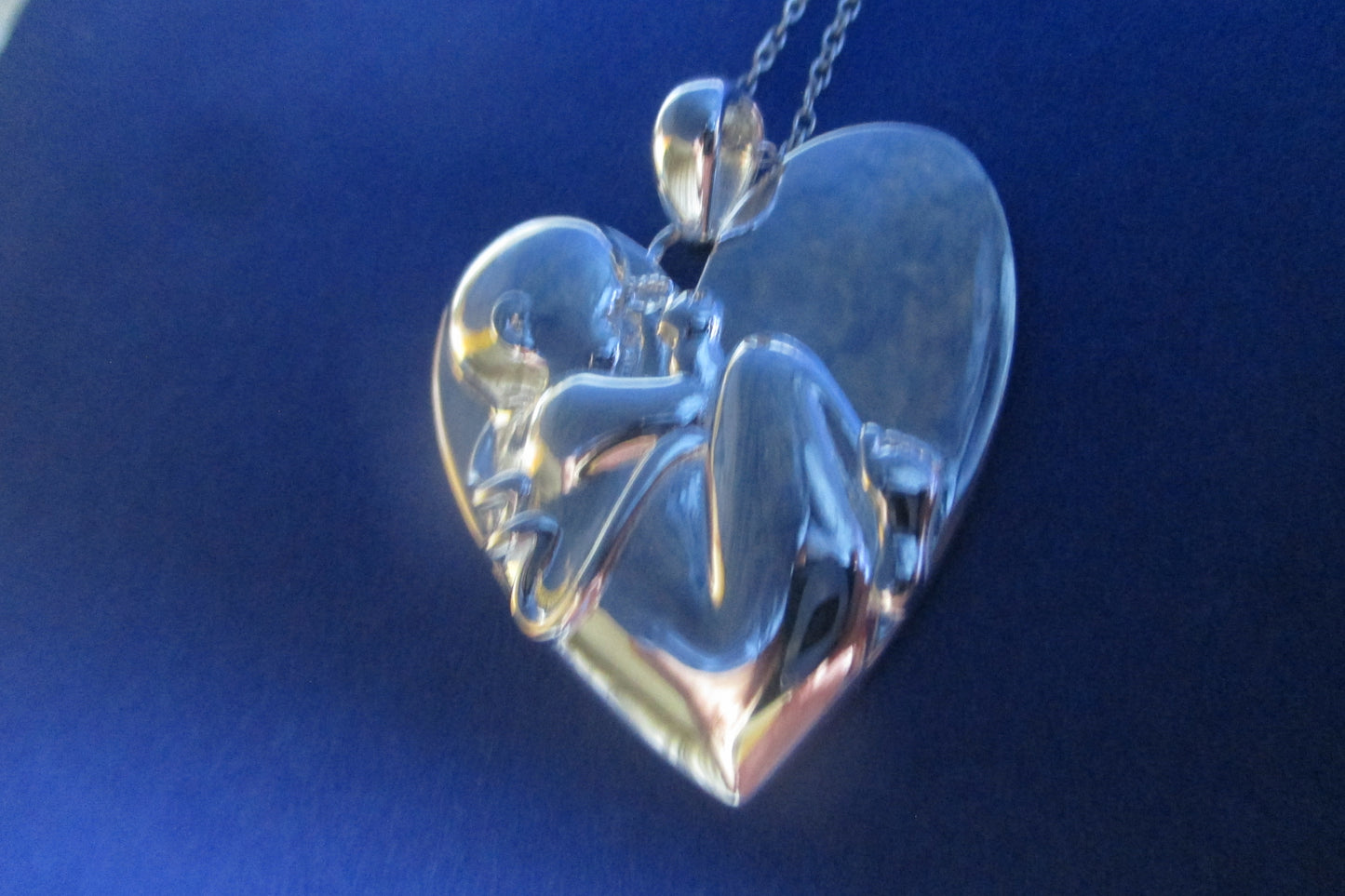 Silver heart Baby in womb pendant