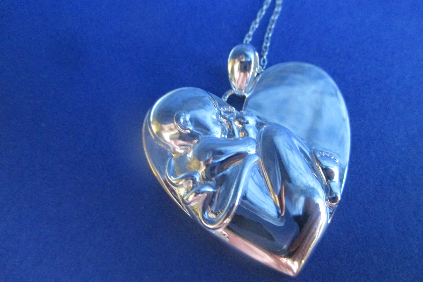 Silver heart Baby in womb pendant