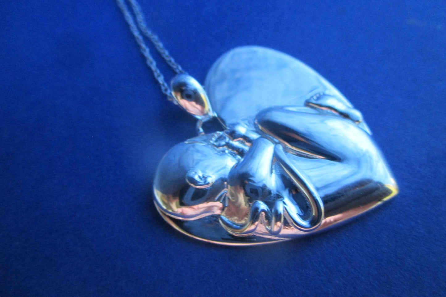 Silver heart Baby in womb pendant