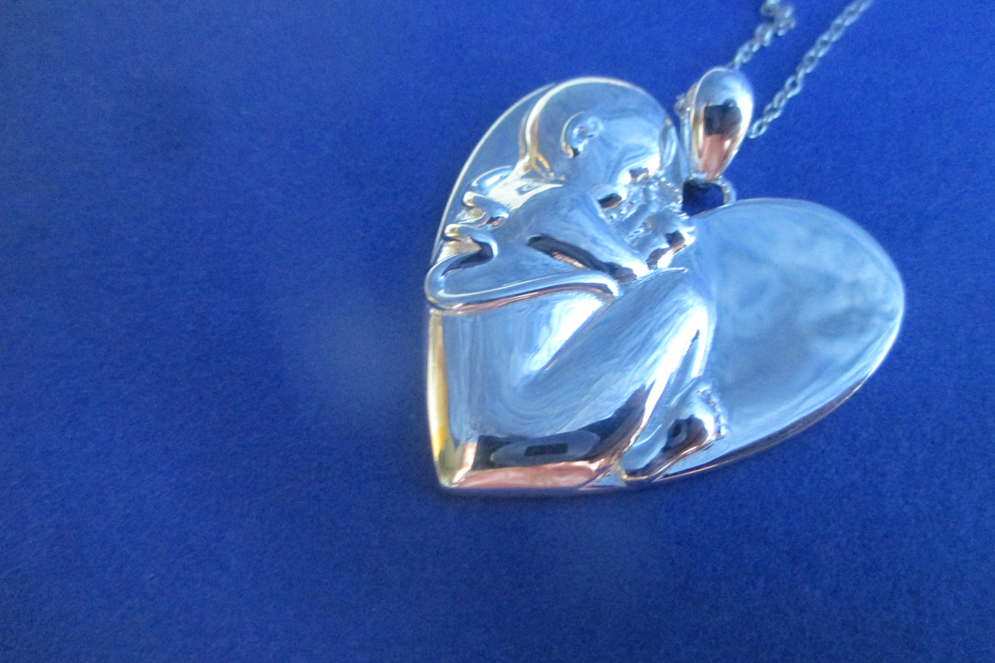 Silver heart Baby in womb pendant