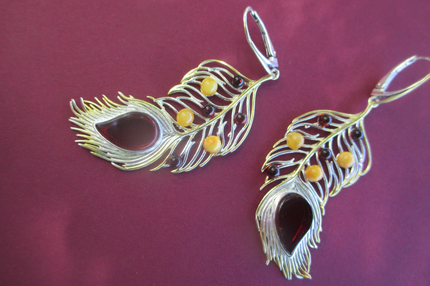 Amber peacock feather earrings