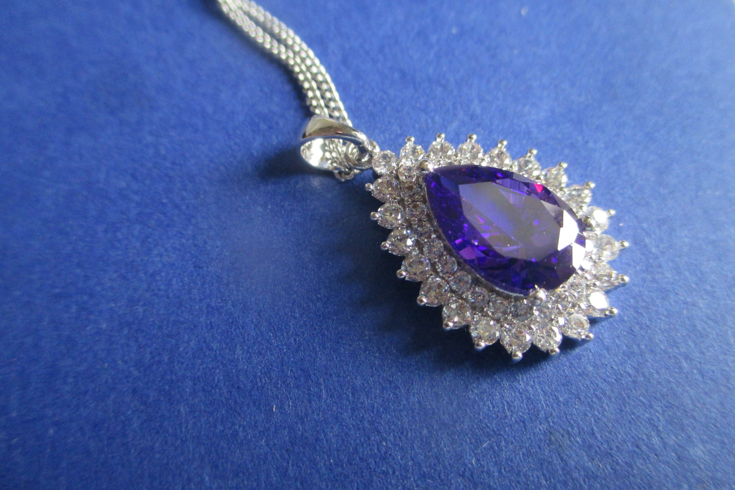 Pear violet stone silver pendant